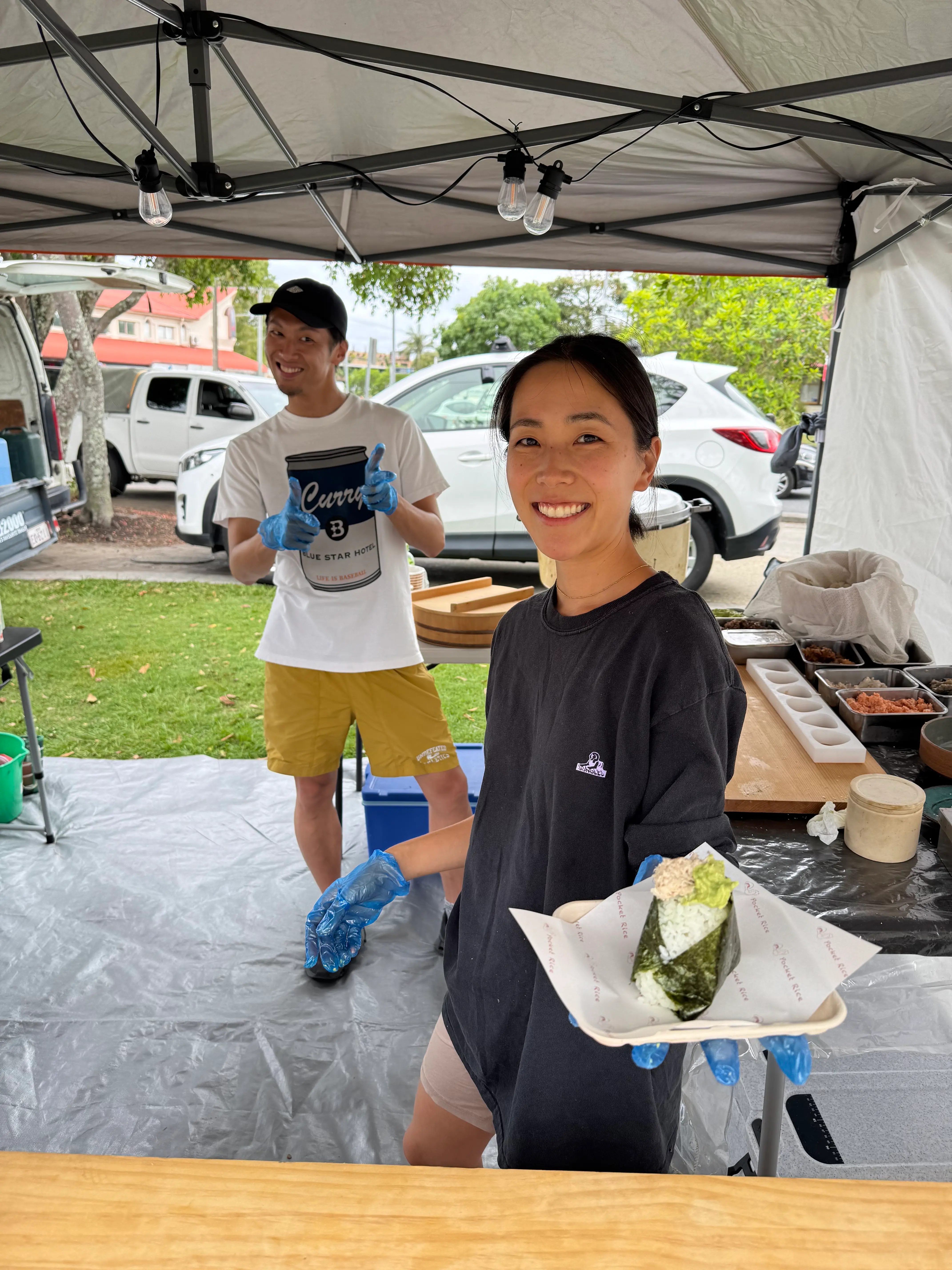 Pocket Rice market stall with onigiri and handwritten display details