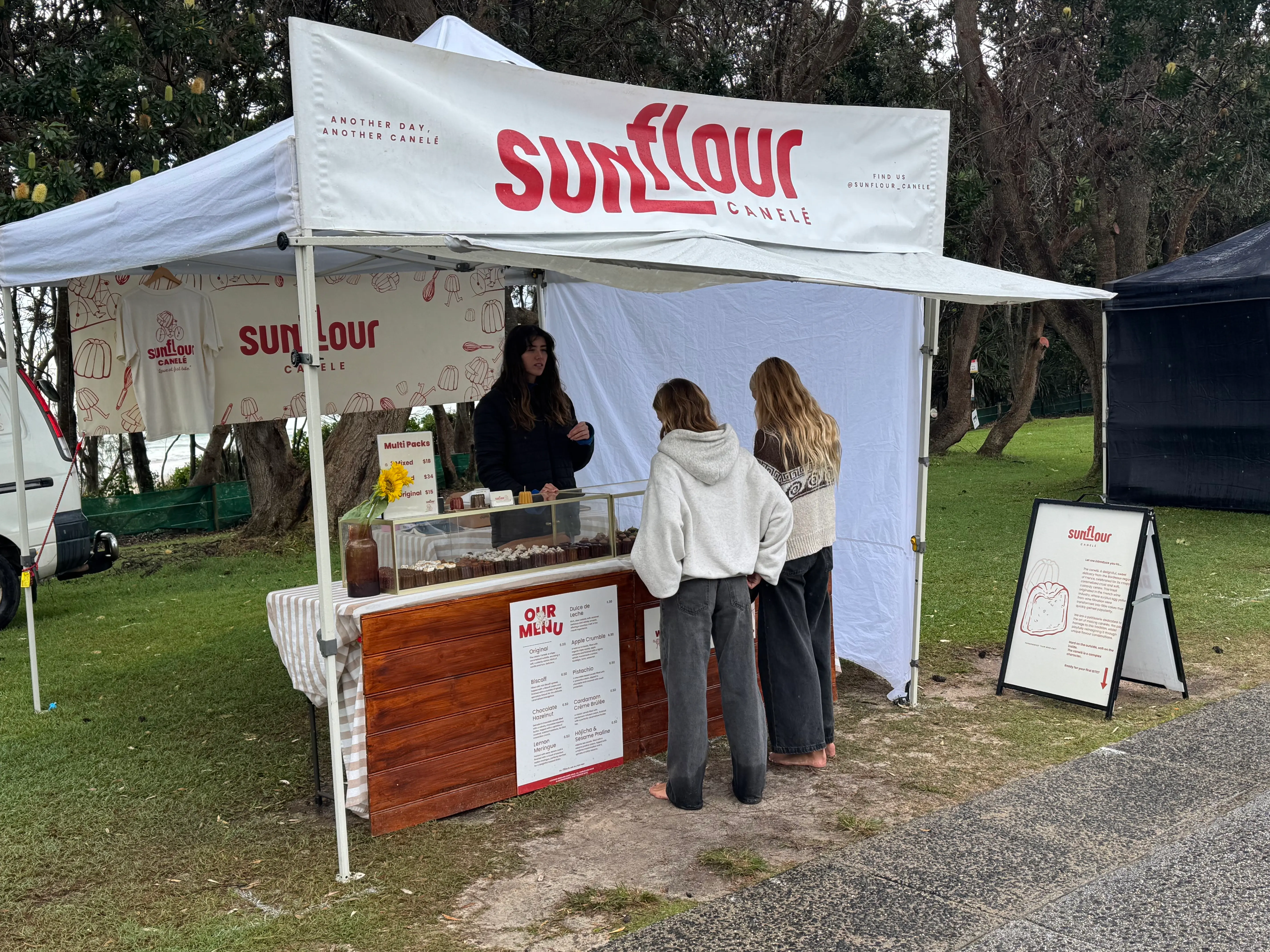 Sunflour Canele stall at Byron Community Market with caneles on display