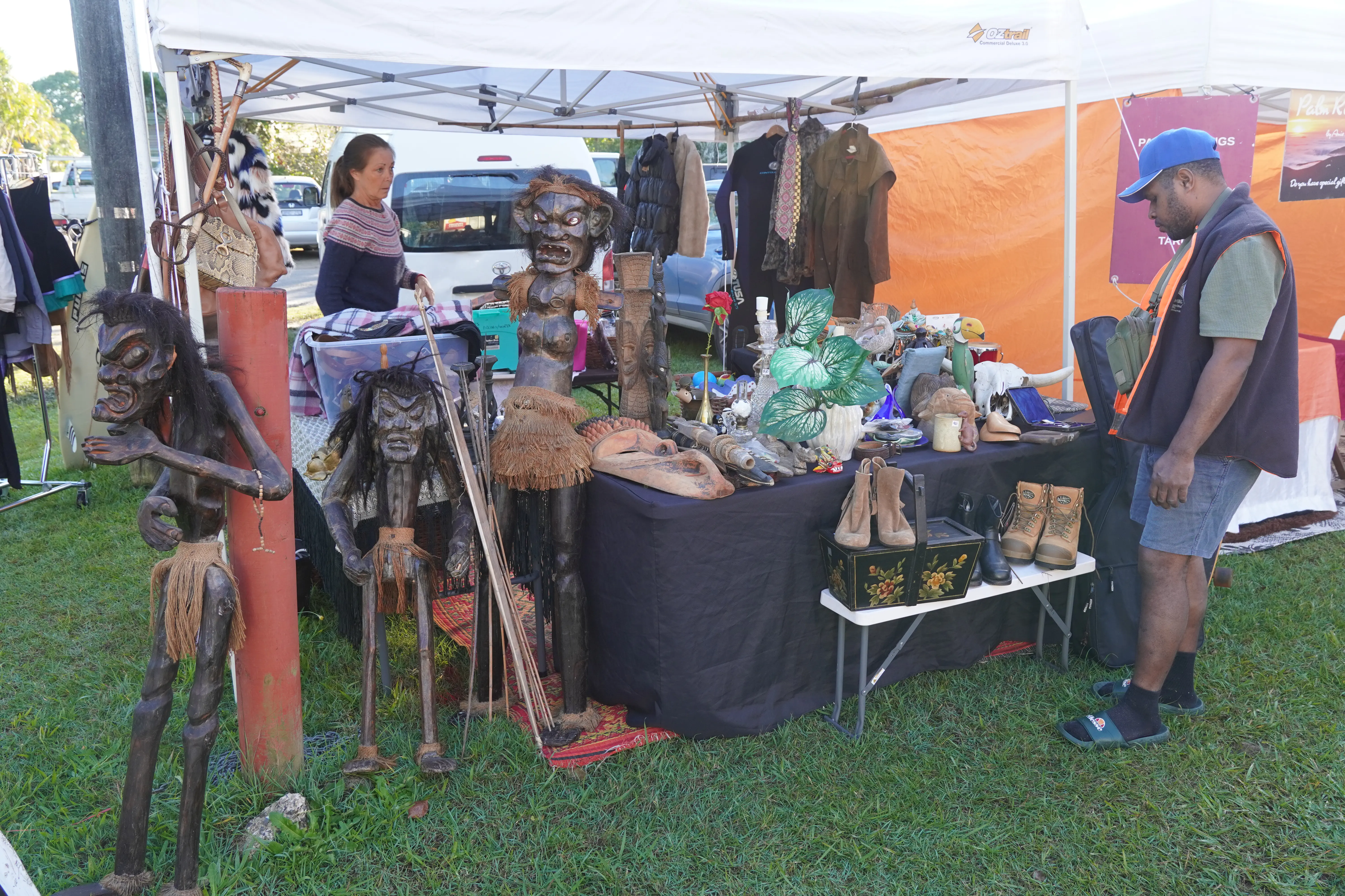Nearby stalls and market displays at Mullumbimby Community Markets